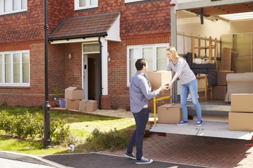 Professional movers handling desks and equipment in Southgate