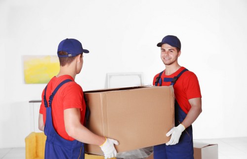 Furniture being carried carefully during a Southgate house removal