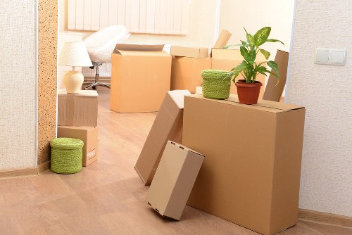 Southgate moving day scene with boxes, protective blankets, and a removals van