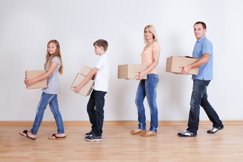 Packed office boxes and furniture ready for transport in Southgate